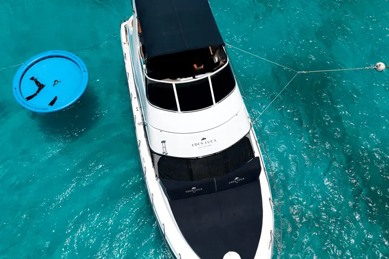 Close drone view over the Eden Luca bow cushions of Eden Luca Blue, the SunChill float alongside