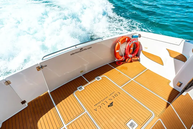 Teak swim platform of Eden Luca Blue with the wake trailing behind