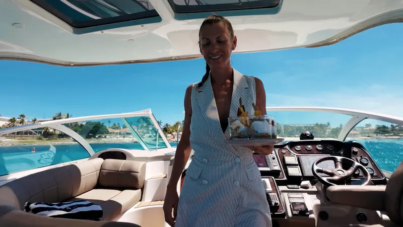 Eden Luca crew member bringing drinks to guests in the cockpit of Eden Luca Red