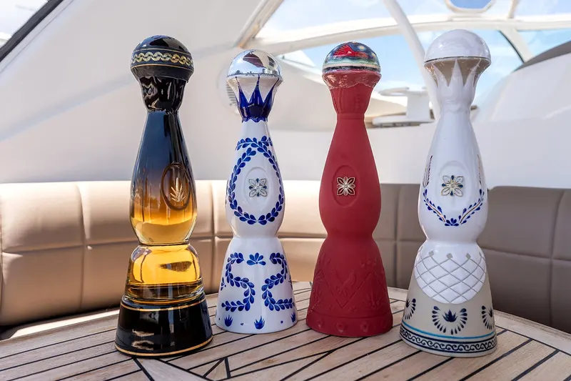 Premium tequila bottles lined up on the aft deck, an optional upgrade for celebrations