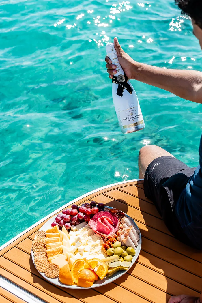 Moët & Cheese Platter Over Turquoise Water