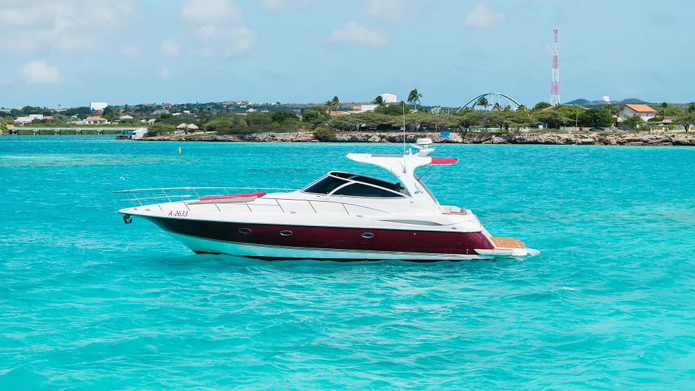 Eden Luca Red, Side Profile Anchored in Turquoise Water